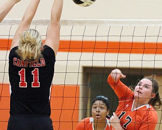 William D. Lewis The Vindicator Howland's Haley Vandergrift(17) Faith Grant(7) returns a shot past Canfield's Alyssa Householder(11) during 8-3--17 action at Howland.Howland's Faith Grant(7) is in background.