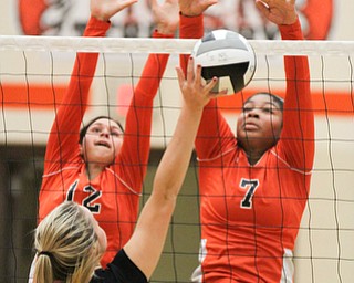 William D. Lewis The Vindicator Canfild's Natalie Maras(23)  reyturns a shot past  Howland's Clare Summerfield(12) and Faith Grant (7) during 8-3--17 action at Howland.