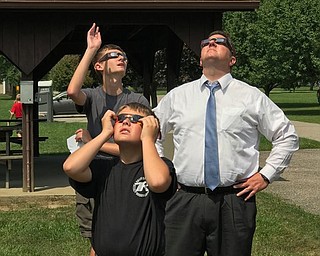 Neighbors | Submitted.Canfield’s Boy Scout Troop 25 had a solar eclipse viewing event on Aug. 21 at Fair Park. Pictured viewing the eclipse are, from left, (front) Wesley Rich; (back) Josh Farley and Jason Farley