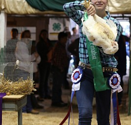 Olivia Reph(16) of Berlin Center shows off her Broiler chickens at auction at the 171st Canfield Fair, Friday, Sept. 1, 2017, at the Canfield Fairgrounds in Canfield...(Nikos Frazier | The Vindicator)