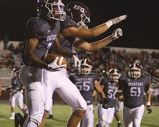             ROBERT  K. YOSAY | THE VINDICATOR..Howland Tigers at Boardman Stadium ..Boardmans #7  Keyshawn Colmand and #4Alex Huzicka celebrate Boardmans third quarter TD