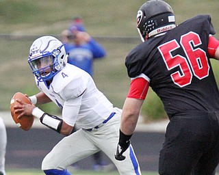 William D. Lewis The Vindicator Hubbard QB Davion Daniels(4) scrambles while eluding Girard's Jack DelGarbino(56) during 1rst half action at Girard 9-1-17.