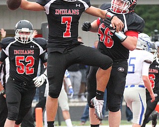 William D. Lewis The Vindicator Girard QBMark Waid(7) gets congrats from Jack DelGarbino(56) after scoring  during 1rst half action at Girard 9-1-17.