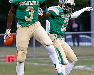 MICHAEL G TAYLOR | THE VINDICATOR-9-01-17 FOOTBALL Youngstown East Golden Bears vs Ursuline Irish at Rayen Stadium, Youngstown, OH    1st qtr., after his TD reception, Ursuline's #3 James Phillips celebrates with his teammate #2 Julian Johnson.