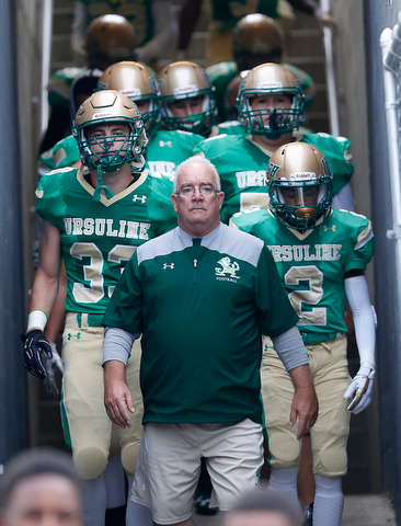 MICHAEL G TAYLOR | THE VINDICATOR-9-01-17 FOOTBALL Youngstown Golden Bears vs Ursuline Irish at Rayen Stadium, Youngstown, OH    Head Coach Larry Kempe brings his team down the tunnel
