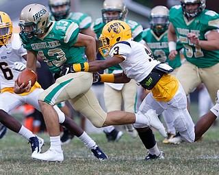 MICHAEL G TAYLOR | THE VINDICATOR-9-01-17 FOOTBALL Youngstown East Golden Bears vs Ursuline Irish at Rayen Stadium, Youngstown, OH    1st qtr., Ursuline's qb #13 Jared Fabry runs for the 1st as East'#3 Greg Lincoln makes the tackle.