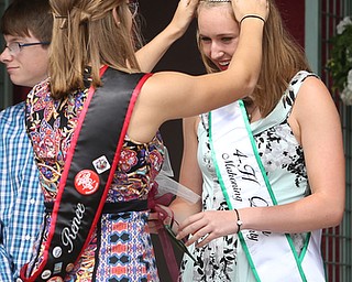 Tiffany Voland(right) is crowned the 2017 4-H Queen by 2016 Queen, Renee Reisner at the Youth Day Ceremony at the 171st Canfield Fair, Thursday, August 31, 2017, at the Canfield Fairgrounds in Canfield...(Nikos Frazier | The Vindicator)
