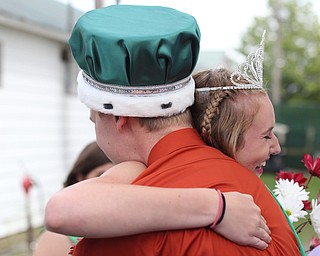 Carson Markley is hugged by Tiffany Voland after being crowned 2017 4-H King and Queen at the Youth Day Ceremony at the 171st Canfield Fair, Thursday, August 31, 2017, at the Canfield Fairgrounds in Canfield...(Nikos Frazier | The Vindicator)