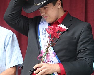 Tyler Moff looks up as he is crowned the 2017 Outstanding Youth at the Youth Day Ceremony at the 171st Canfield Fair, Thursday, August 31, 2017, at the Canfield Fairgrounds in Canfield...(Nikos Frazier | The Vindicator)