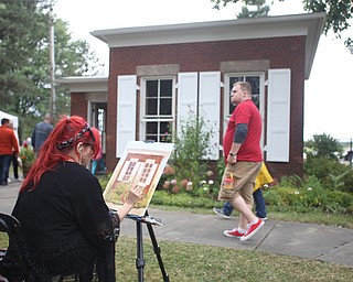 Christy Kacvinsky of Poland paints a "En Plein Air" in the Western Reserve Village at the 171st Canfield Fair, Friday, Sept. 1, 2017, at the Canfield Fairgrounds in Canfield...(Nikos Frazier | The Vindicator)