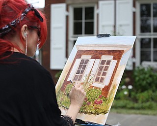 Christy Kacvinsky of Poland paints a "En Plein Air" in the Western Reserve Village at the 171st Canfield Fair, Friday, Sept. 1, 2017, at the Canfield Fairgrounds in Canfield...(Nikos Frazier | The Vindicator)