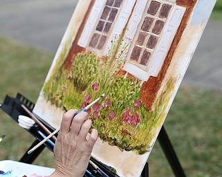 Christy Kacvinsky of Poland paints a "En Plein Air" in the Western Reserve Village at the 171st Canfield Fair, Friday, Sept. 1, 2017, at the Canfield Fairgrounds in Canfield...(Nikos Frazier | The Vindicator)