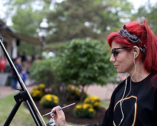 Christy Kacvinsky of Poland paints a "En Plein Air" in the Western Reserve Village at the 171st Canfield Fair, Friday, Sept. 1, 2017, at the Canfield Fairgrounds in Canfield...(Nikos Frazier | The Vindicator)