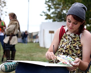 Lindsey Hettersek of Edenburg, Pa. paints a "En Plein Air" near the Veteran's Memorial at the 171st Canfield Fair, Friday, Sept. 1, 2017, at the Canfield Fairgrounds in Canfield...(Nikos Frazier | The Vindicator)