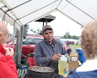 Terry Hacon talks with onlookers about his popcorn process at the 171st Canfield Fair, Saturday, Sept. 2, 2017, at the Canfield Fairgrounds in Canfield...(Nikos Frazier | The Vindicator)