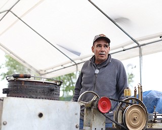 Terry Hacon talks with onlookers about his popcorn process at the 171st Canfield Fair, Saturday, Sept. 2, 2017, at the Canfield Fairgrounds in Canfield...(Nikos Frazier | The Vindicator)