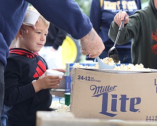 Brandon Miller(4) of Austintown waits his turn to scoop some popcorn at the 171st Canfield Fair, Saturday, Sept. 2, 2017, at the Canfield Fairgrounds in Canfield...(Nikos Frazier | The Vindicator)