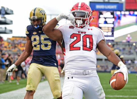 PITTSBURGH, PENNSYLVANIA - SEPTEMBER 2, 2017:  Youngstown State's Christian Turner celebrates after scoring a touchdown and beating Elijah Zeise during the second half of their game Saturday afternoon at Heinz Field. Pitt won 28-21 in overtime. (DAVID DERMER | THE VINDICATOR)