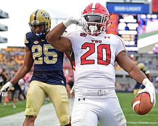 PITTSBURGH, PENNSYLVANIA - SEPTEMBER 2, 2017:  Youngstown State's Christian Turner celebrates after scoring a touchdown and beating Elijah Zeise during the second half of their game Saturday afternoon at Heinz Field. Pitt won 28-21 in overtime. (DAVID DERMER | THE VINDICATOR)