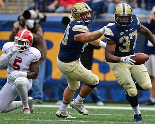 PITTSBURGH, PENNSYLVANIA - SEPTEMBER 2, 2017:  Pittsburgh's Quadree Ollison celebrates with Colton Lively after scoring a touchdown during the first half of their game Saturday afternoon at Heinz Field. Pitt won 28-21 in overtime. (DAVID DERMER | THE VINDICATOR)..Youngstown State's Lee Wright pictured.