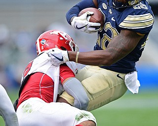 PITTSBURGH, PENNSYLVANIA - SEPTEMBER 2, 2017:  Pittsburgh's Darrin Hall is tackled by Youngstown State's Darius Shackleford during the first half of their game Saturday afternoon at Heinz Field. Pitt won 28-21 in overtime. (DAVID DERMER | THE VINDICATOR)