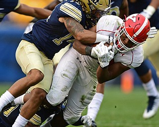 PITTSBURGH, PENNSYLVANIA - SEPTEMBER 2, 2017:  Youngstown State's Youngstown State's Tevin McCaster is tackled by Pittsburgh's Avonte Maddox during the second half of their game Saturday afternoon at Heinz Field. Pitt won 28-21 in overtime. (DAVID DERMER | THE VINDICATOR)