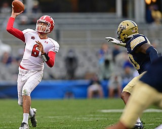 PITTSBURGH, PENNSYLVANIA - SEPTEMBER 2, 2017:  Youngstown State's Hunter Wells throws a pass while being pressured by Pittsburgh's James Folson Jr. during the second half of their game Saturday afternoon at Heinz Field. Pitt won 28-21 in overtime. (DAVID DERMER | THE VINDICATOR)