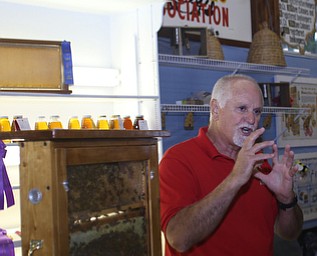 Jim Santini of the Columbiana Mahoning-County Beekeeping association talks about bees at stop #7 on the Ag-Venture at the 171st Canfield Fair, Saturday, Sept. 2, 2017, at the Canfield Fairgrounds in Canfield...(Nikos Frazier | The Vindicator)
