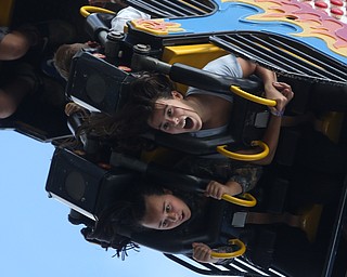 Sisters Gracelyn(13)(left) and Rosalyn(12) Kelty of Canfield ride the Fireball at the 171st Canfield Fair, Sunday, Sept. 3, 2017, at the Canfield Fairgrounds in Canfield...(Nikos Frazier | The Vindicator)