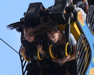 Sisters Gracelyn(13)(left) and Rosalyn(12) Kelty of Canfield ride the Fireball at the 171st Canfield Fair, Sunday, Sept. 3, 2017, at the Canfield Fairgrounds in Canfield...(Nikos Frazier | The Vindicator)