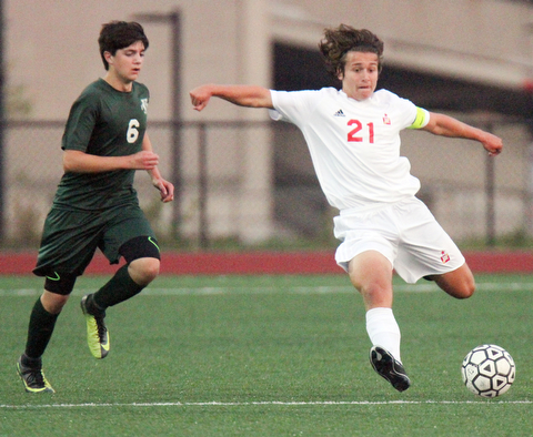 William D. Leiws The vindicator  Ursuline's Leo Puhulla(6) and  Mooney's Paul Graziano(21) go for the ball during 9-5-17 action at YSU.