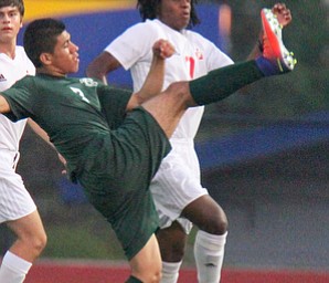 William D. Leiws The vindicator  Ursuline's Mario Ruano(7) and ) and  Mooney's Kenny bledsoe(7) go for the ball.