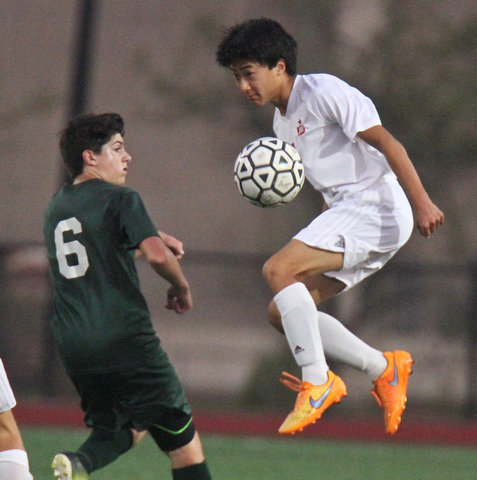 William D. Leiws The vindicator  Ursuline's Leo Puhulla(6) ) and  Mooney's Mark Armile(4) go for the ball during 9-5-17 action at YSU.4