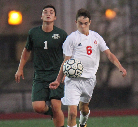 William D. Leiws The vindicator  Ursuline's Emannanuel Kerpelis(1) and  Mooney's Brian Philiban (6) go for the ball during 9-5-17 action at YSU.