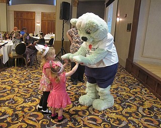 Neighbors | Alexis Bartolomucci.Two girls at the Summer Discovery Author Breakfast met Booker the Bear, the Public Library of Youngstown and Mahoning County's mascot, on July 28.