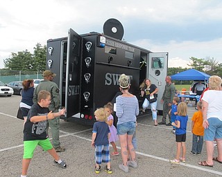 Neighbors | Alexis Bartolomucci.Guests at Austintown Night Out had the opportunity to explore the SWAT truck that was at Austintown Park on Aug. 1.