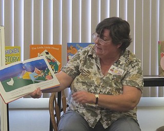 Neighbors | Zack Shively  .Boardman librarian Karen Saunders read "Minerva Louise at the Fair" to the children at Family Story Time at the library on Aug. 30.