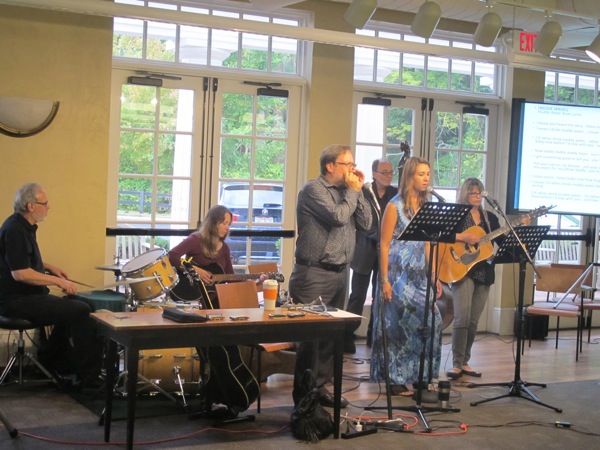 Neighbors | Zack Shively  .Kristi Blue and the Midnites worked with the Poland library and the Oakland Center for the Arts to bring an educational performance detailing the history of the blues to the library.