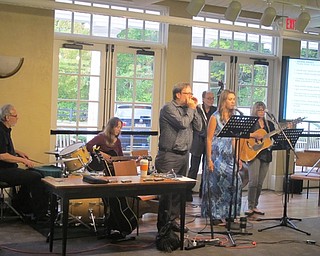 Neighbors | Zack Shively  .Kristi Blue and the Midnites worked with the Poland library and the Oakland Center for the Arts to bring an educational performance detailing the history of the blues to the library.