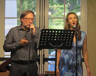 Neighbors | Zack Shively  .Singers Harry Davis and Kristina Pokopatz of Kristi Blue and the Midnites sang together on a blues rendition of "You are My Sunshine" and "When They Saints Go Marching In" during the History of the Blues event at the Poland library on Aug. 31.