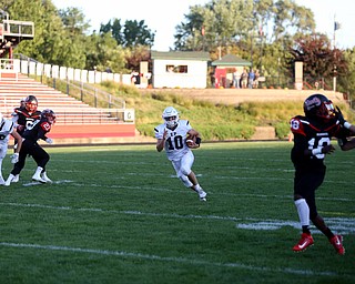 East Palestine quarterback Parker Sherry(10) finds a gab to run in a touchdown in the first quarter as East Palestine takes on Campbell, Friday, Sept. 8, 2017, at John Knapick Field at Campbell Memorial High School in Campbell...(Nikos Frazier | The Vindicator)..