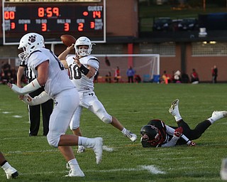 East Palestine quarterback Parker Sherry(10) looks for an open player to score a two-point conversion in the second quarter as East Palestine takes on Campbell, Friday, Sept. 8, 2017, at John Knapick Field at Campbell Memorial High School in Campbell...(Nikos Frazier | The Vindicator)..