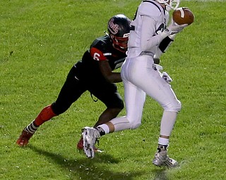 East Palestine wide receiver Joey Monteleone(82) catches the pass as Campbell defenseman Brandon Liggens(6) attempts to bring him down in the second quarter as East Palestine takes on Campbell, Friday, Sept. 8, 2017, at John Knapick Field at Campbell Memorial High School in Campbell...(Nikos Frazier | The Vindicator)..