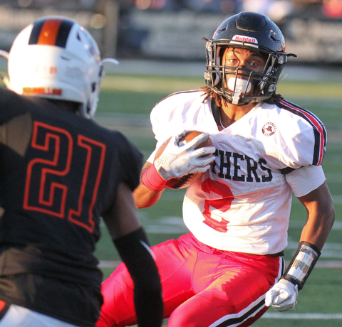 William D. Lewis The Vindicator Harding's KAyron Adams(2)eludes Massilon's Anthony Ballard(21)during 9-8-17 game at Harding.