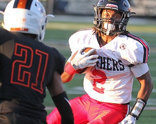 William D. Lewis The Vindicator Harding's KAyron Adams(2)eludes Massilon's Anthony Ballard(21)during 9-8-17 game at Harding.