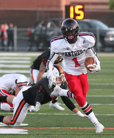 William D. Lewis The Vindicator Harding's Jalen Hooks(1)) is stopped by MAssilons Logan Anania(1) during 9-8-17 game at Harding.