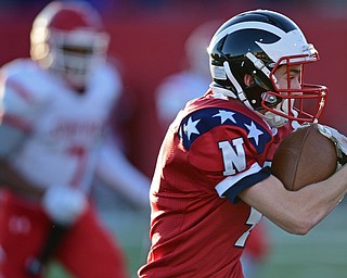 NILES, OHIO - SEPTEMBER 8, 2017: Niles's Trent Johnson runs the football upfield after a reception during the first half of their game Friday night at Niles High School. DAVID DERMER | THE VINDICATOR..Struther's Willie Mitchell pictured.