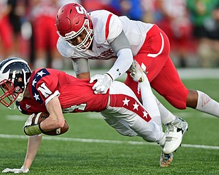 NILES, OHIO - SEPTEMBER 8, 2017: Niles's Trent Johnson is tackled from behind by Struthers's Willie Mitchell during the first half of their game Friday night at Niles High School. DAVID DERMER | THE VINDICATOR