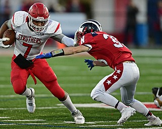 NILES, OHIO - SEPTEMBER 8, 2017: Struthers's Willie Mitchell stiff arms Niles's Brandon Hayes for extra yardage during the first half of their game Friday night at Niles High School. DAVID DERMER | THE VINDICATOR