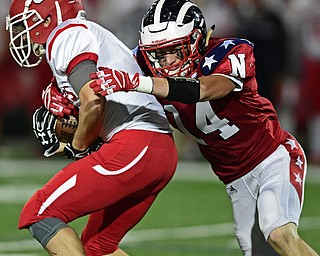 NILES, OHIO - SEPTEMBER 8, 2017: Struthers's Tommy Kopnicky, left, is tackled by Niles's Ernie Cook during the first half of their game Friday night at Niles High School. DAVID DERMER | THE VINDICATOR